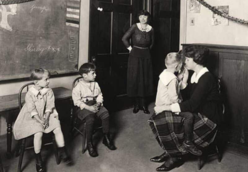 early CID classroom with 4 students and 2 teachers, showing small class size and one-on-one instruction